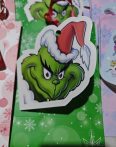   Papír tasak zöld+üdvözlő kártyával+szalaggal Boldog békés karácsonyi ünnepeket felírattal grincs 18,3x11,7x7,4cm 10db/csomag